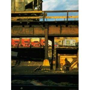 Moody Sunlight Showing Arty Grouping of Hopper Car, Rusting Elevated 