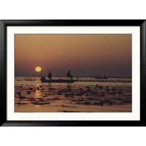 Fishermen Take in the First Rays of the Rising Sun on Lake Okeechobee 