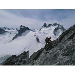  A Climber Ascends Bugaboo Spire with Howser Towers in the 