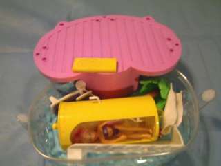 This MATTEL 02 FASHION POLLY POCKET POOL SET W/ ACCESSORIES is in 