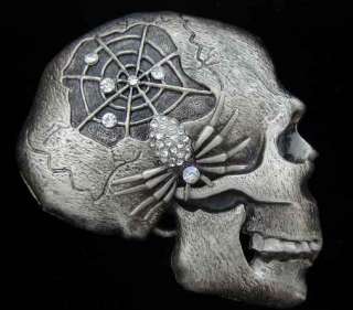   skull and spider design decorated with rhinestones creepily impressive