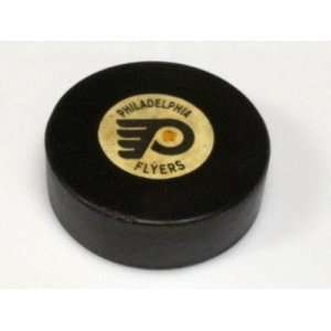   Flyers 70s converse game used hockey puck   Game Used NHL Pucks
