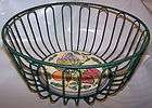 green wire basket with ceramic tile bottom bread or fruit