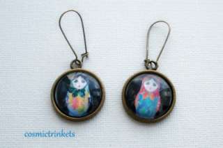  antiqued bronze tone earrings have two pretty Russian Doll images 