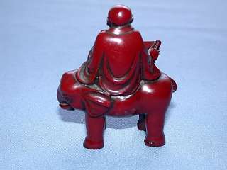 This auction is for a Vintage Red Lacquered Chinese Man on Elephant 
