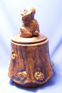PUPPY ON A TREE STUMP COOKIE JAR WITH NUMBER IN LID.  